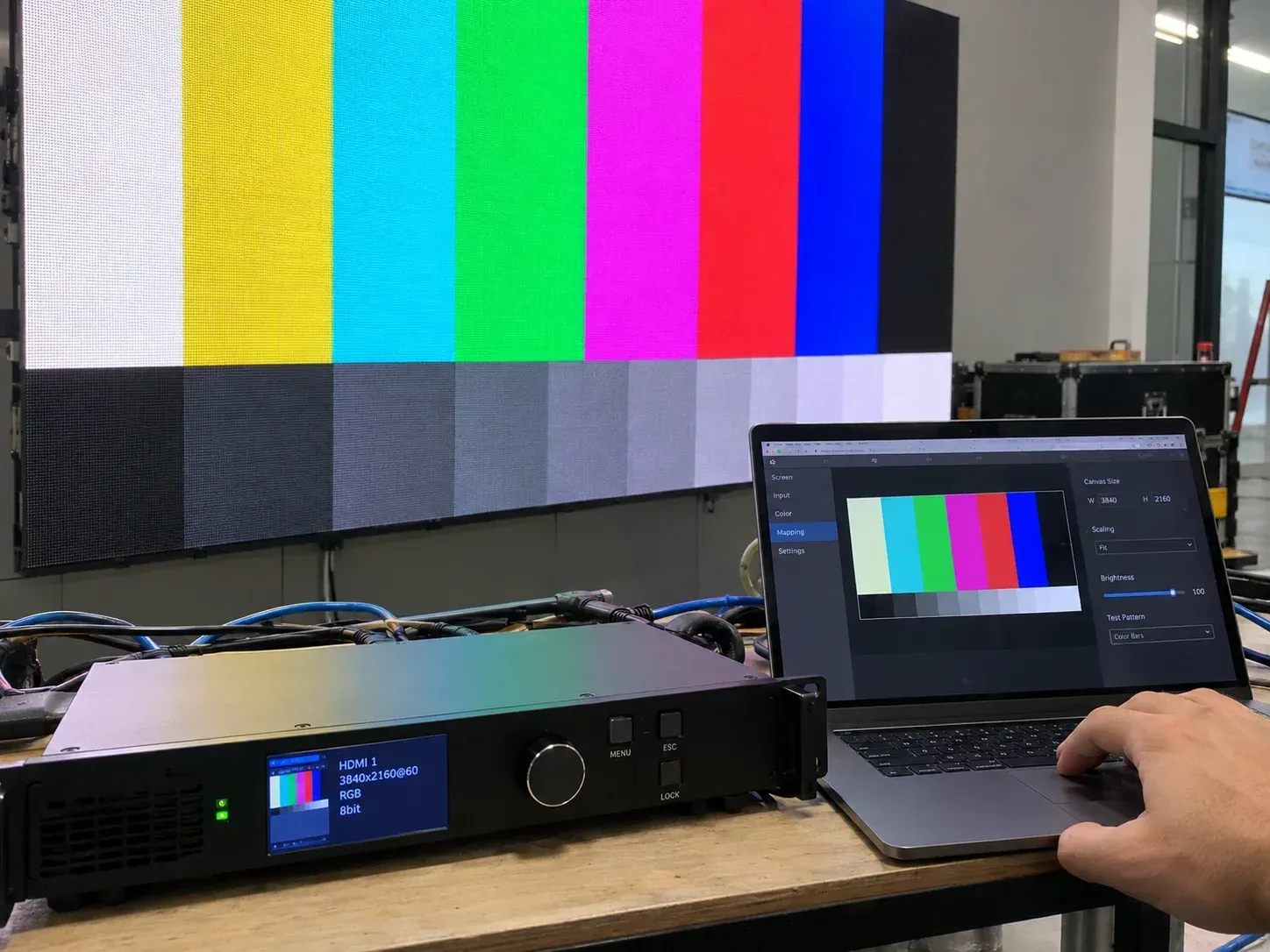 Technician commissioning signal equipment for an LED wall